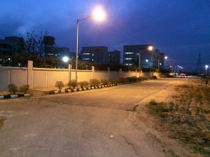 Below the lamplight, the bump in the road is the Lakshman Rekha. In the distance are the girls' hostels.